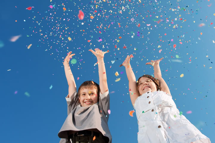 Happy children dancing in coffetti